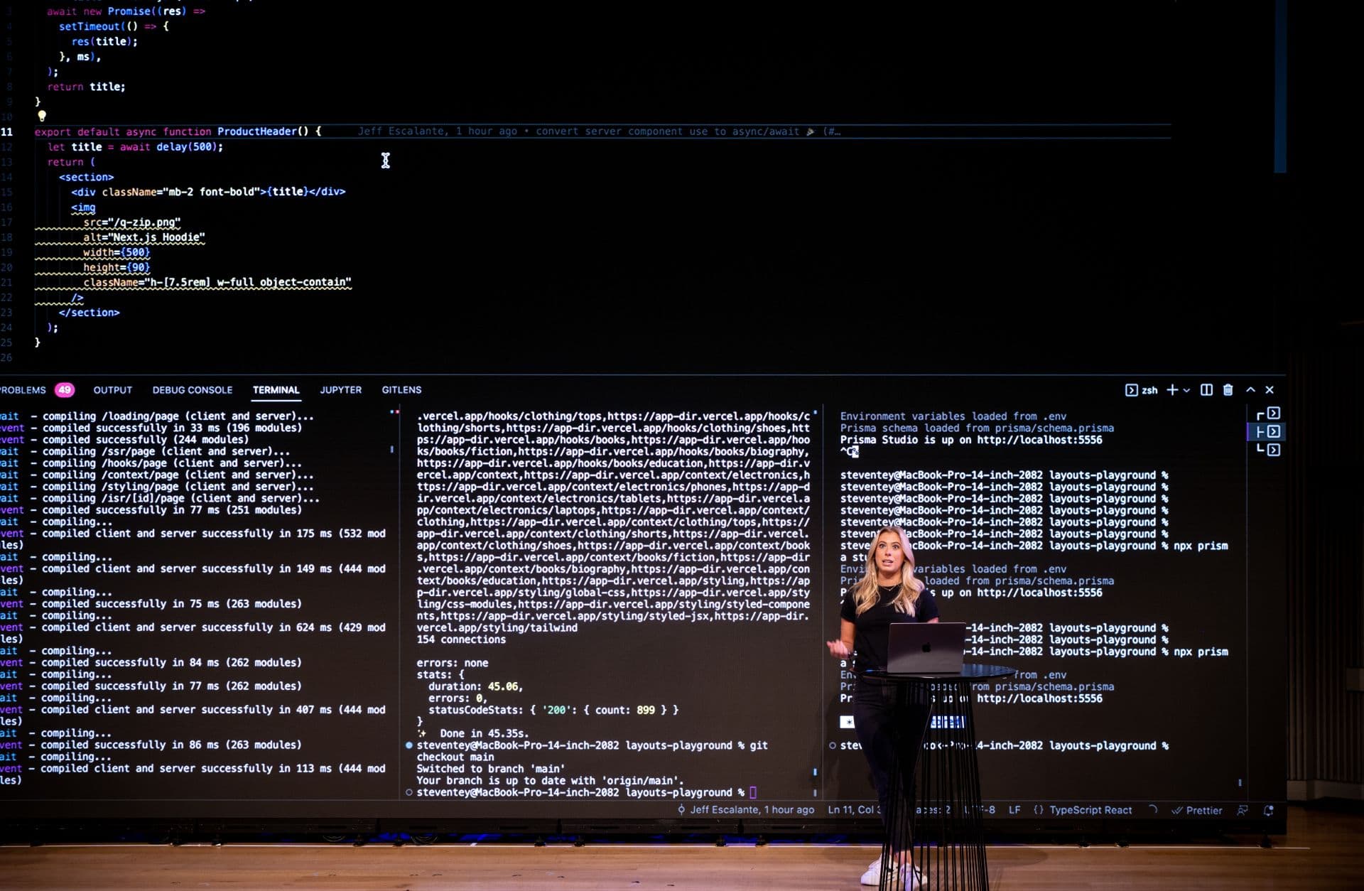 a woman standing at a podium in front of a screen