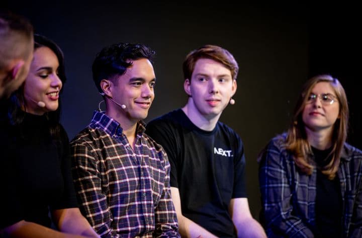 a group of people sitting next to each other