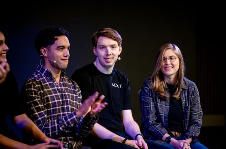 a group of people sitting next to each other