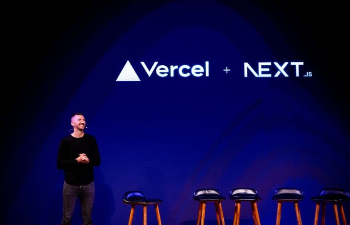 a man standing in front of a row of stools