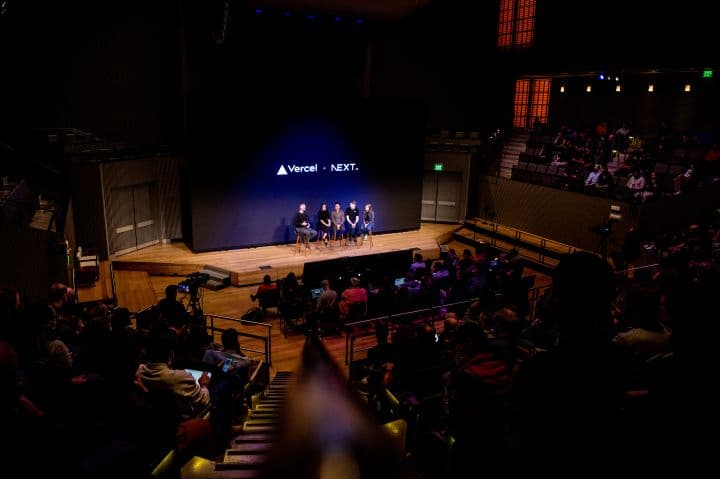 a group of people standing on top of a stage