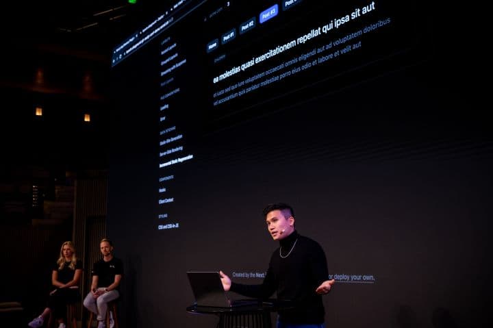 a man standing in front of a laptop computer