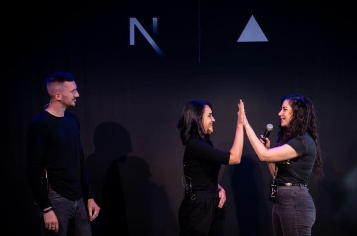 two people giving each other a high five