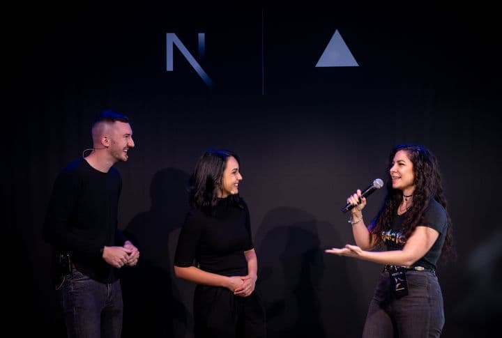 a man and two women standing next to each other