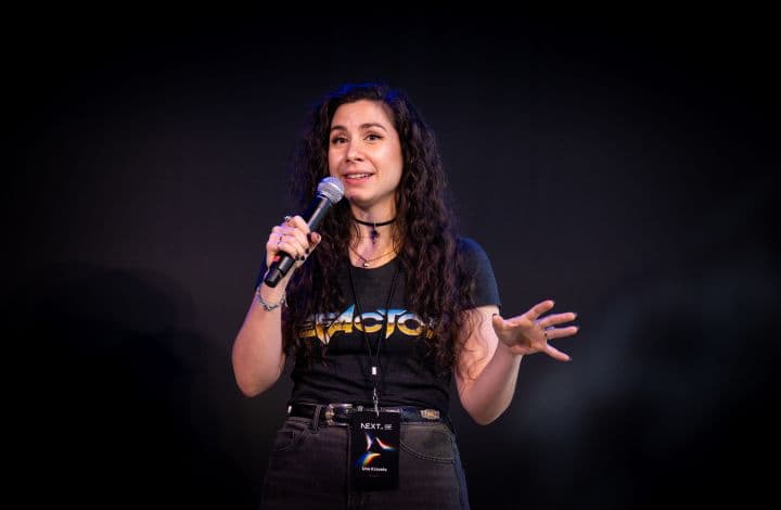 a woman standing in front of a microphone