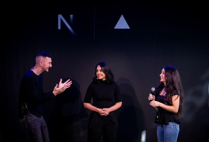 two women and a man are talking to each other