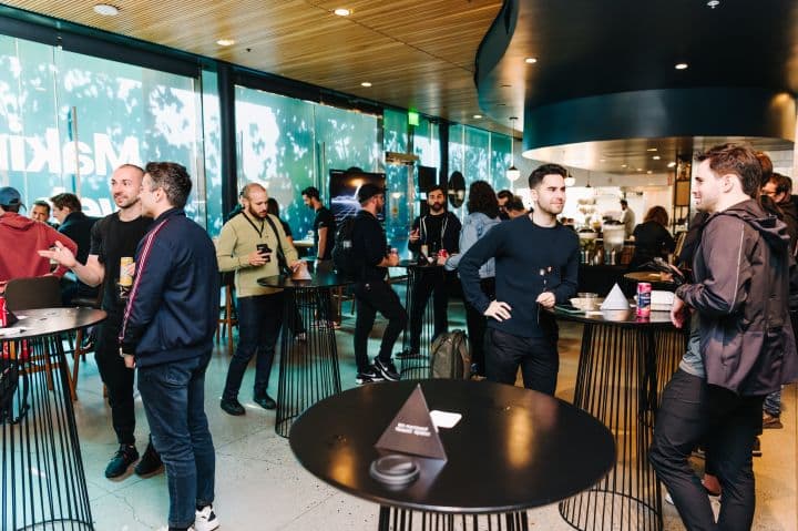 a group of people standing around a restaurant