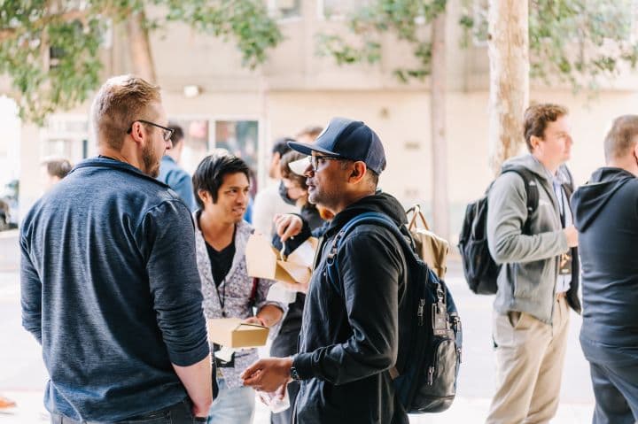 a group of people standing next to each other