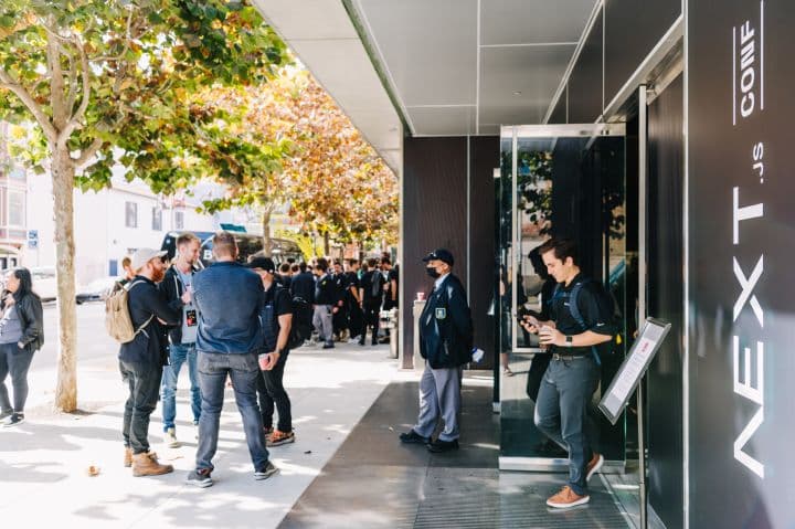 a group of people standing outside of a building