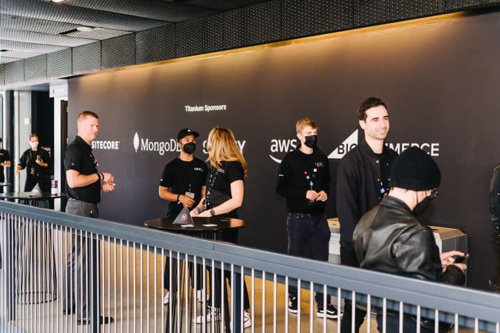 a group of people standing in front of a wall