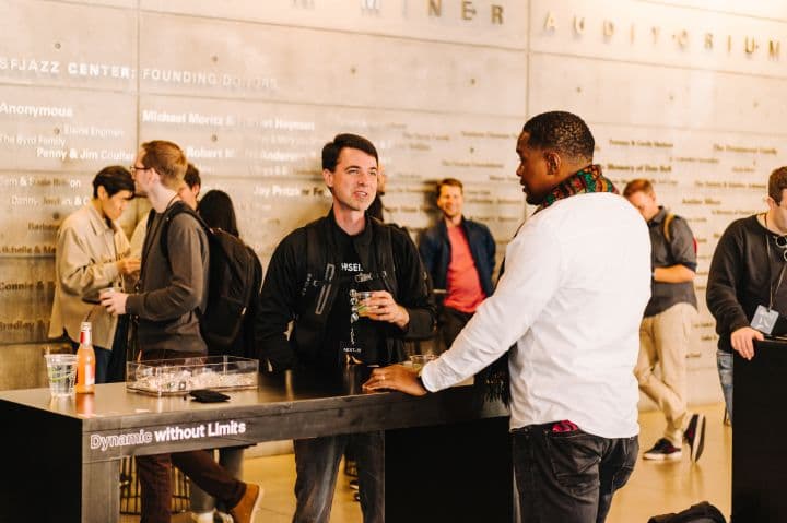 a group of people standing around a counter