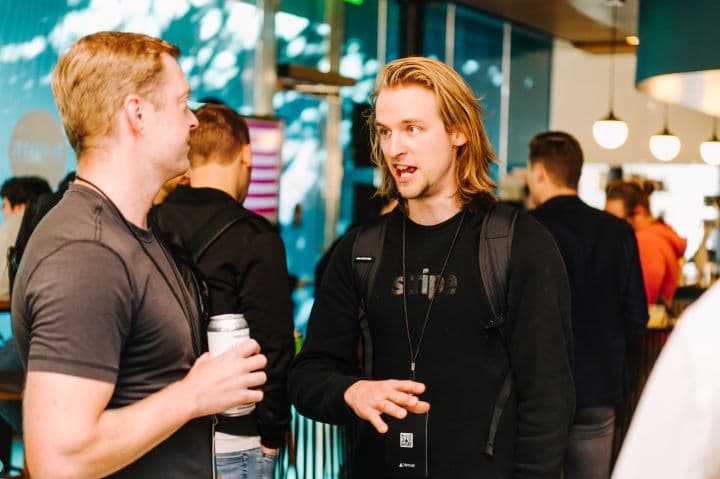 a couple of men standing next to each other