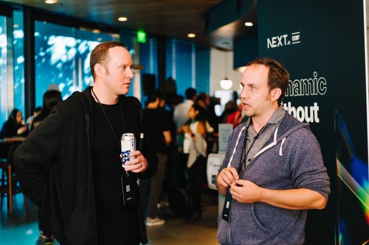 a couple of men standing next to each other