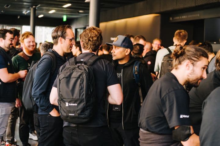 a group of people standing around each other