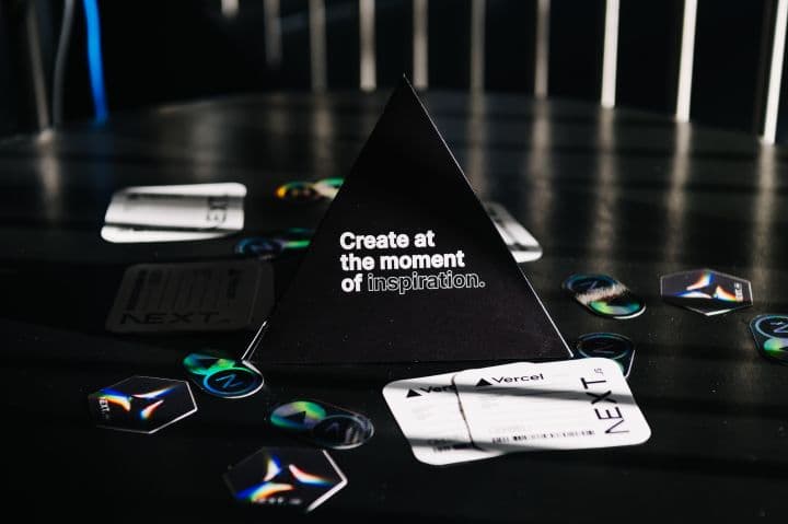 a black triangle shaped object sitting on top of a table