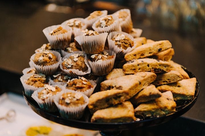 a plate full of cookies and muffins on a table