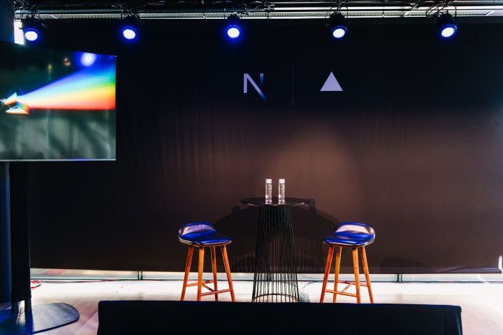 a couple of stools sitting on top of a stage