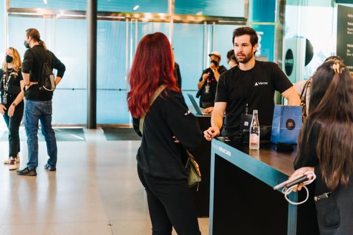 a group of people standing around a counter