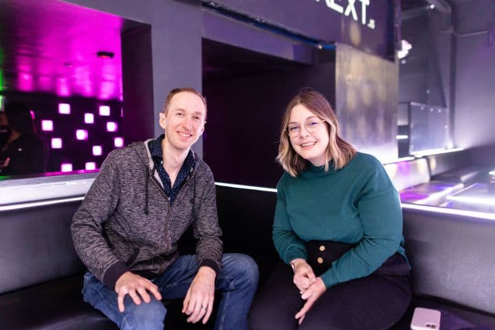 a man and a woman sitting on a bench