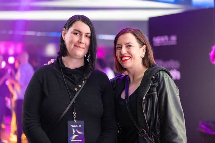 a couple of women standing next to each other