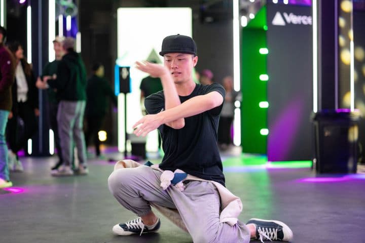 a man kneeling on the ground with his arms out