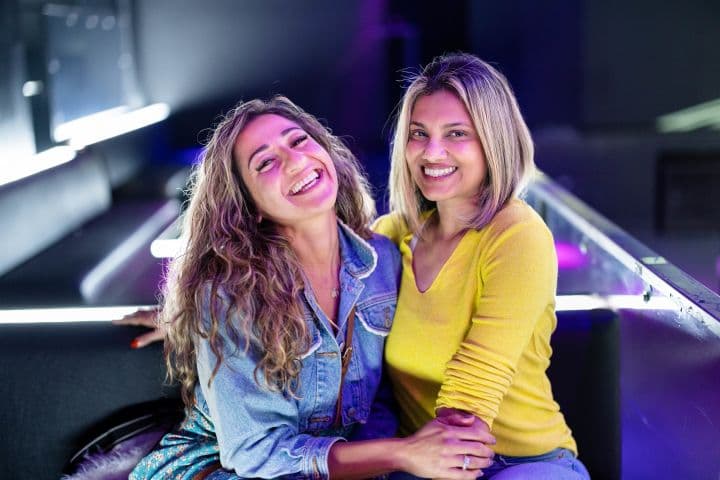 two women sitting next to each other