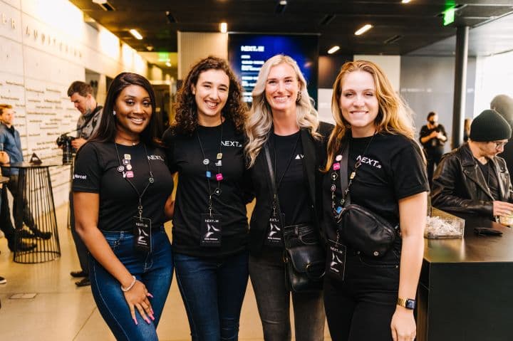 a group of women standing next to each other